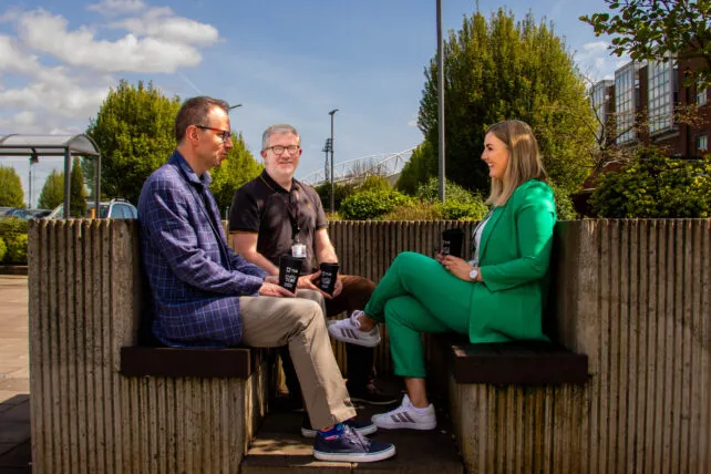 TUS HR Manager Peter Doyle (left), with Dr Stacey Cannon Cahill or Dermot Maleney Joint Programme Leads for the MA in Leadership in Workplace Health and Wellbeing at TUS sitting with reusable cups outside TUS Moylish Campus