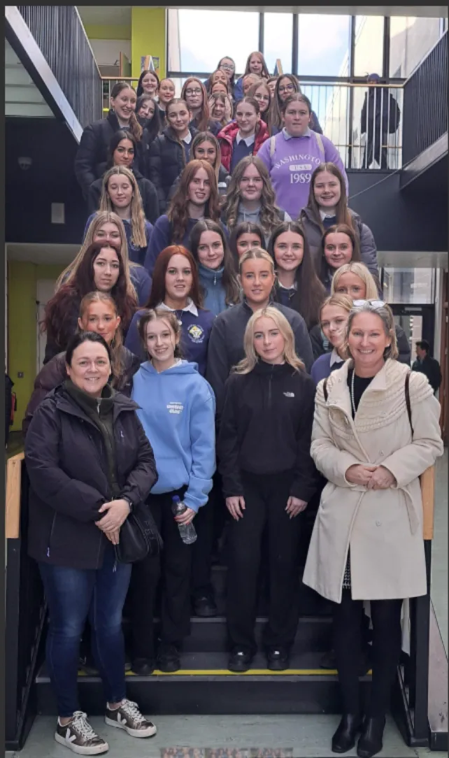Photo of secondary school students posing on a stairs smiling for the camera at the TUS Athlone Campus Women in Engineering event.