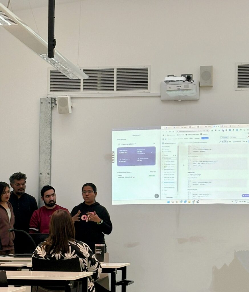 Josephine doing a presentation with her team at TUS